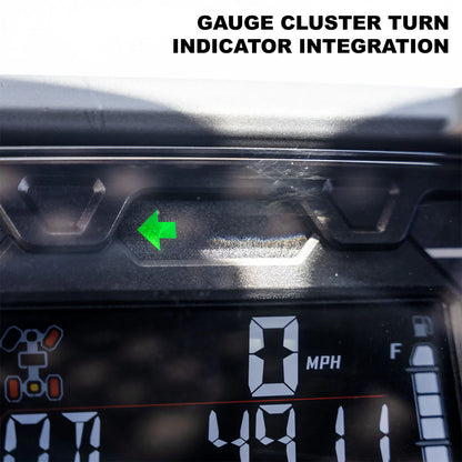  dashboard with gauge cluster turn indicator integration showing a green arrow.