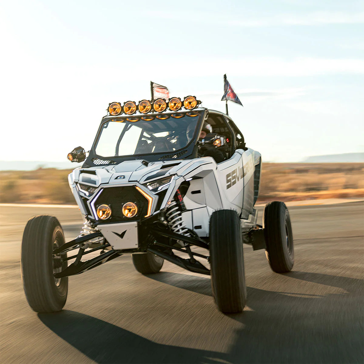 Off-road vehicle with large tires on a track