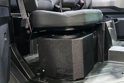 Black storage box under a folded seat in a vehicle interior