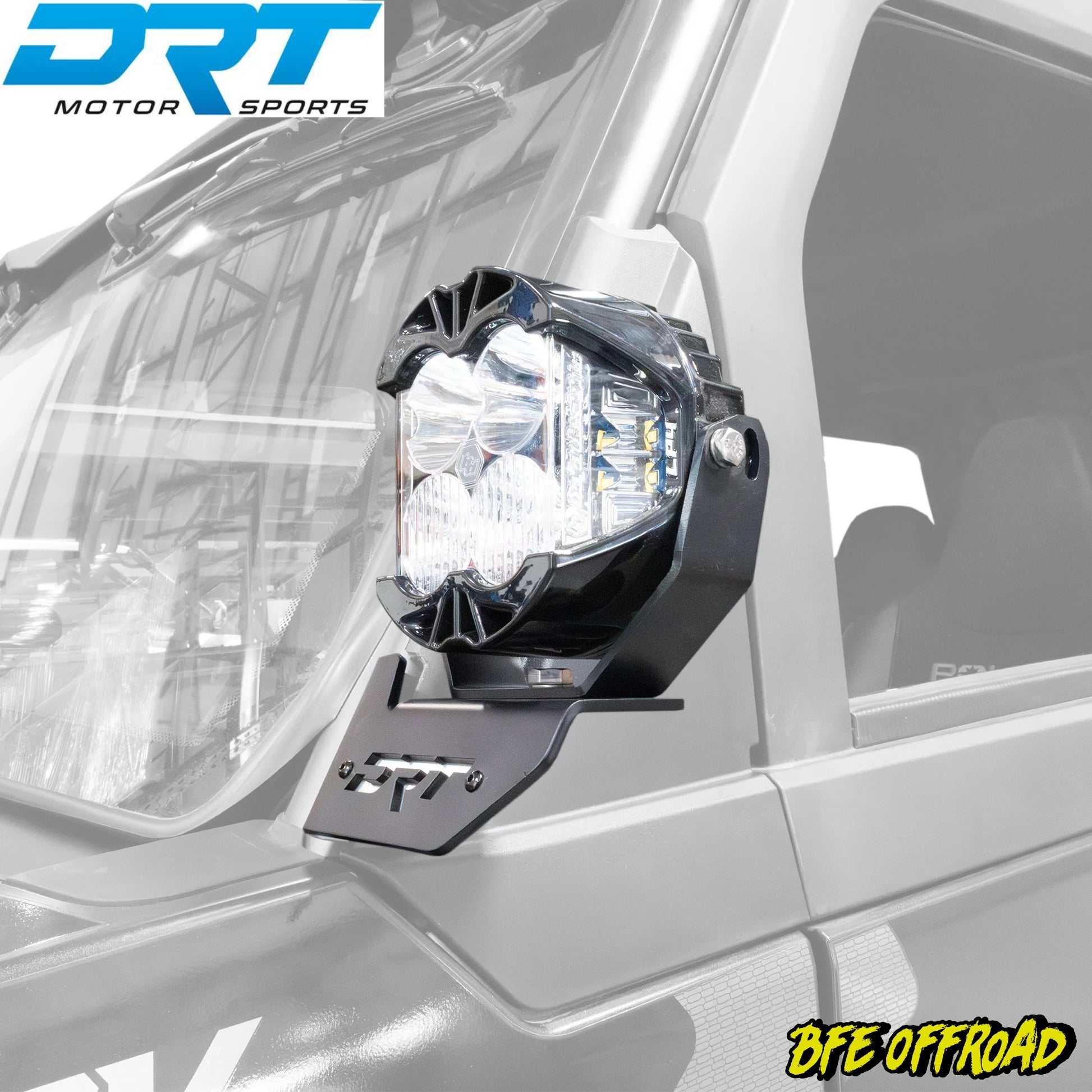 Off-road vehicle light mount with DRT Motor Sports branding on a vehicle.