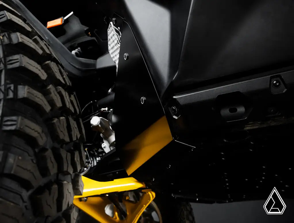 Close-up of a vehicle's undercarriage with a yellow component and tire.