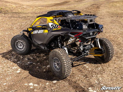 Can-Am off-road vehicle on a dirt surface with 'SuperATV' branding.