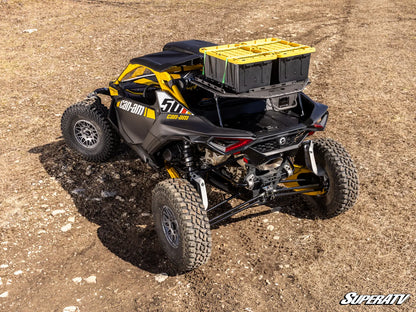 Black and yellow off-road vehicle on a dirt surface with 'SuperATV' branding.