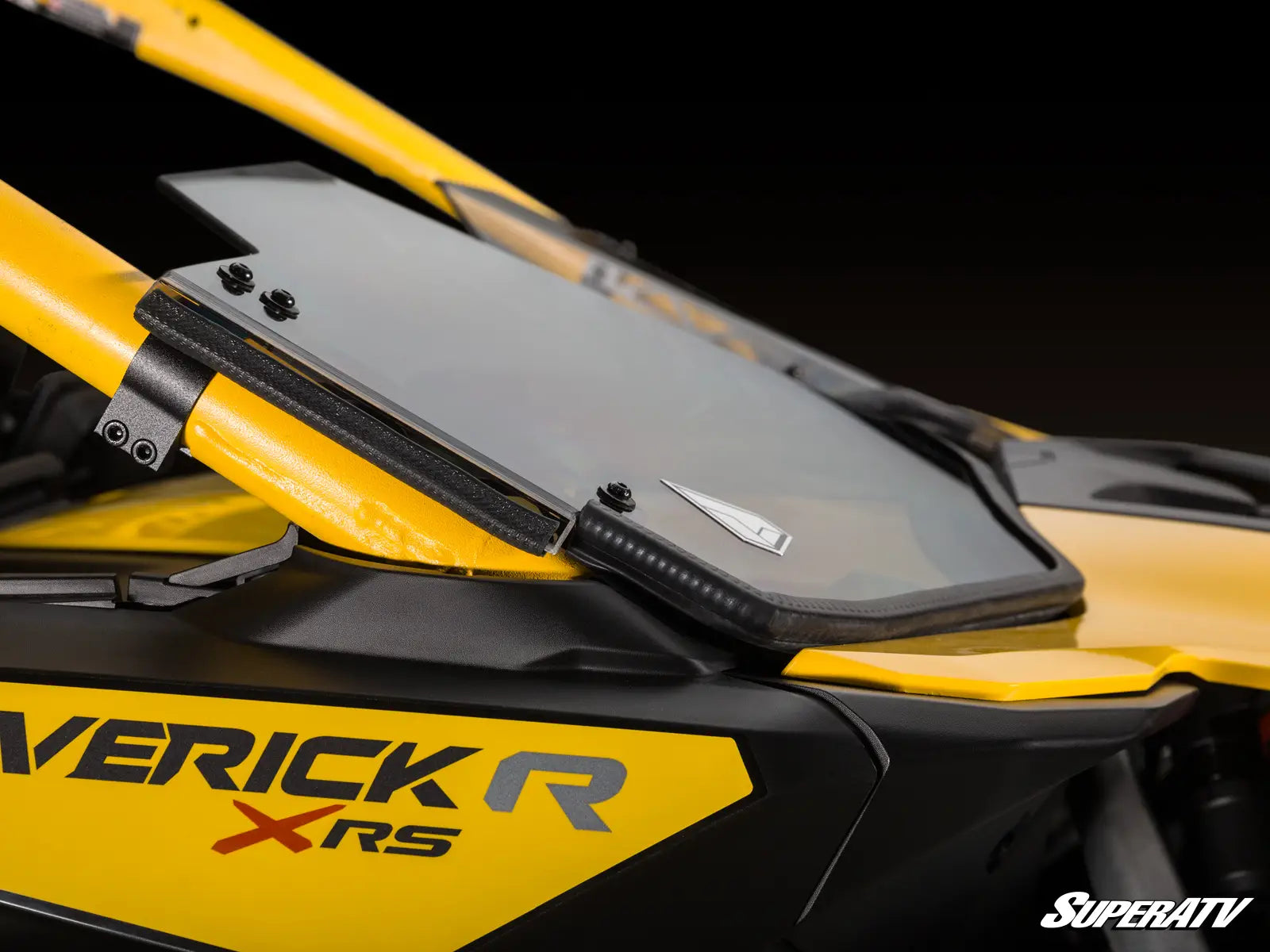 Close-up of a yellow and black ATV with 'Verick R XRS' branding on a dark background.