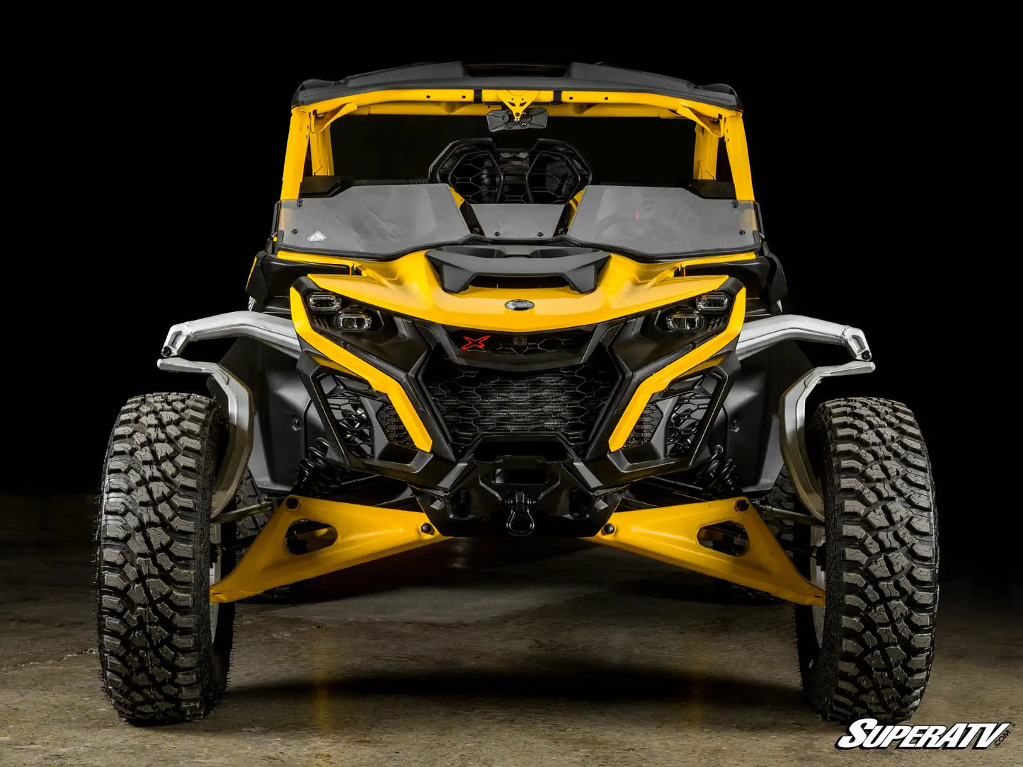 Yellow and black off-road vehicle with 'SuperATV' branding on a dark background