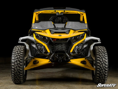 Yellow and black off-road vehicle with 'SuperATV' branding on a dark background