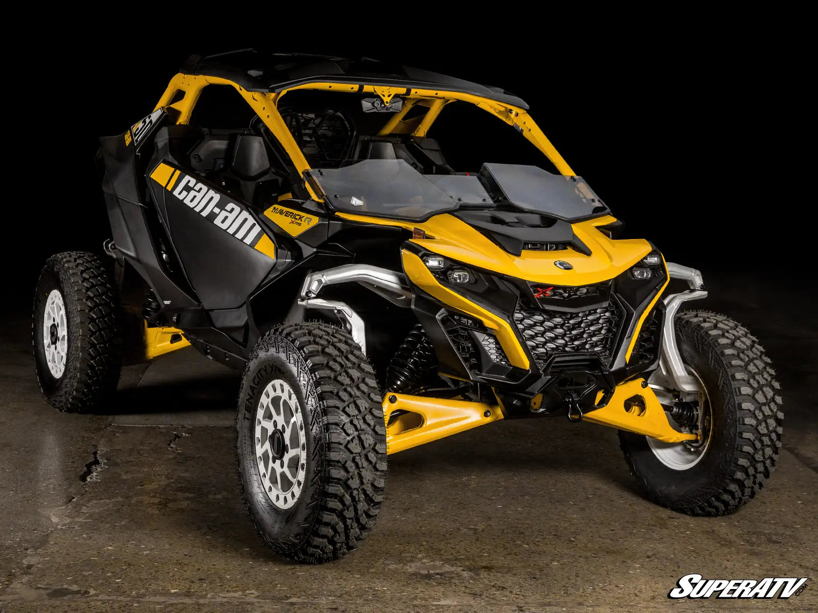 Yellow and black Can-Am vehicle on a dark background
