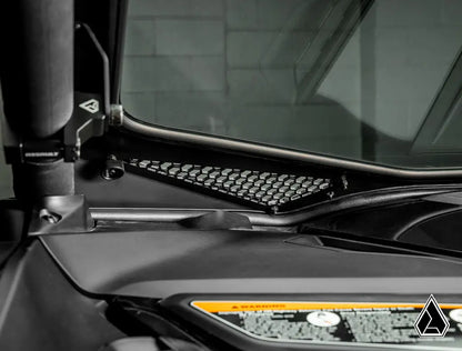 Close-up of a vehicle's interior dashboard with a steering wheel and instrument panel.