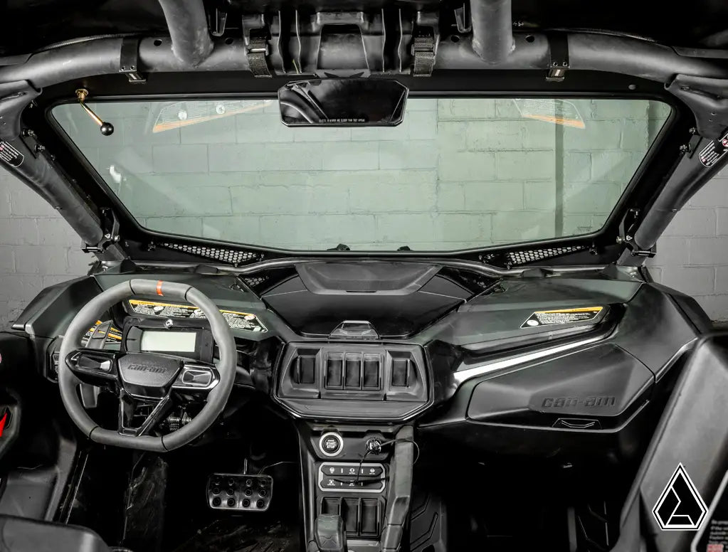 Interior of a high-performance vehicle with a focus on the dashboard and steering wheel.