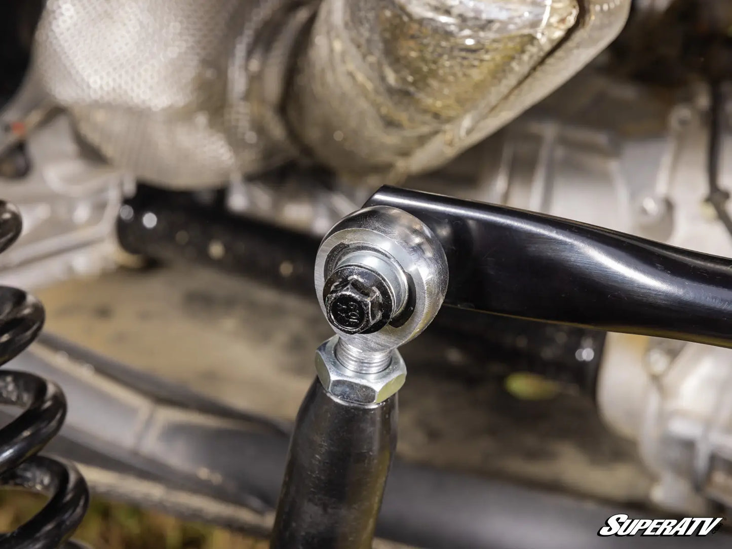 Close-up of a mechanical component with 'SuperATV' branding.