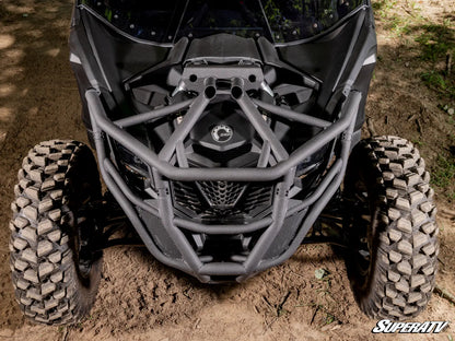 Close-up of an ATV with a SuperATV logo on a dirt surface