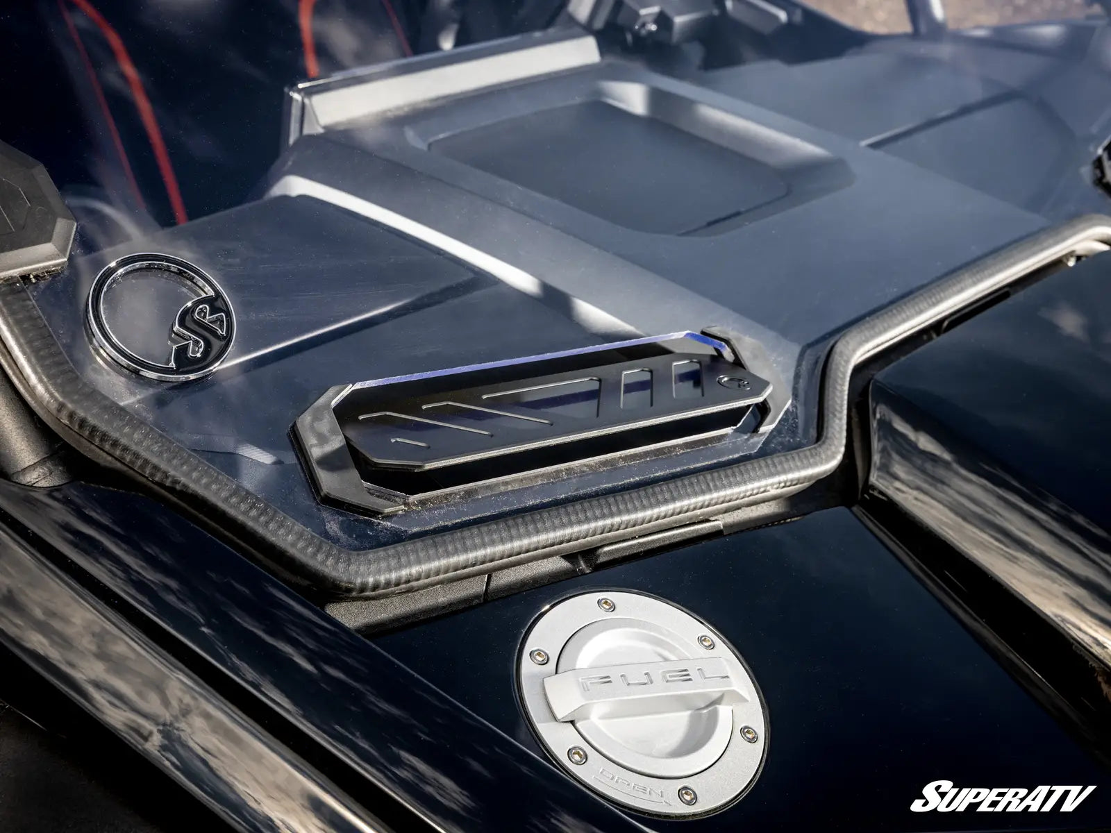 Close-up of a SuperATV branded vehicle with metallic finish