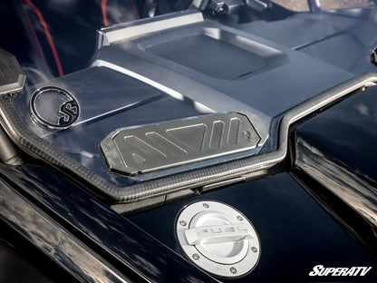 Close-up of a SuperATV branded vehicle part with metallic finish