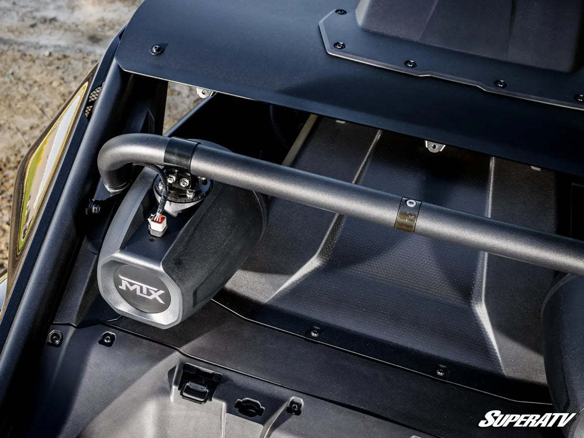 Close-up of a black metal roll bar mounted over a black engine bay area of a vehicle, with a visible silver and black MIX branded canister and a SuperATV logo in the bottom right corner.