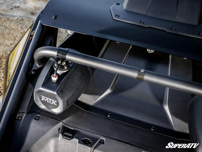 Close-up of a black metal roll bar mounted over a black engine bay area of a vehicle, with a visible silver and black MIX branded canister and a SuperATV logo in the bottom right corner.