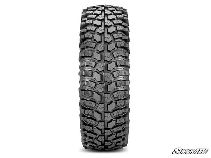 Off-road tire with prominent tread pattern on a white background, featuring the SuperATV logo.