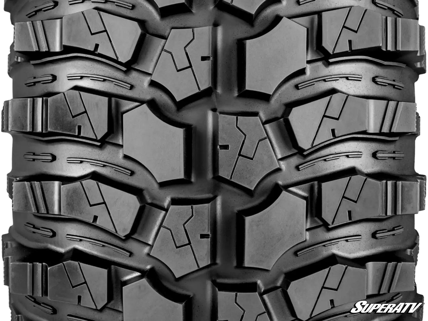 Close-up of a tire with prominent tread pattern, featuring the SuperATV logo.