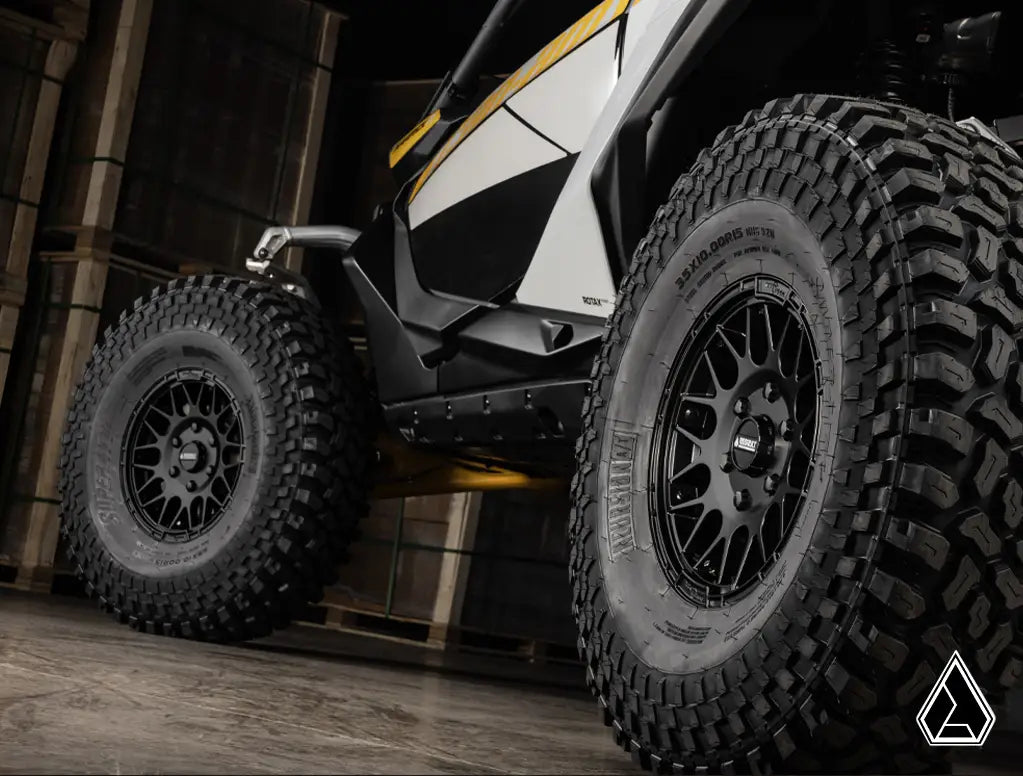 Close-up of off-road vehicle tires with a dark background