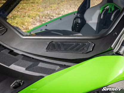 Close-up of a green and black motorcycle with 'SuperATV' branding.