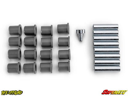 A set of dark gray cylindrical bushings arranged in rows next to a stack of silver metal spacer blocks and a small metal bolt, displayed on a clean white background with BFE Offroad and SuperATV logos in the corners.