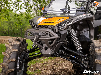 SuperATV off-road vehicle with detailed suspension and front bumper in a forest setting