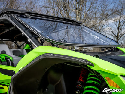 Green off-road vehicle with a transparent roof and SuperATV logo.