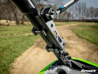 Close-up of a SuperATV product on a vehicle with a blurred natural background