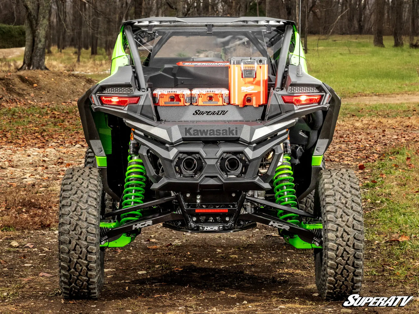 Kawasaki SuperATV vehicle in a forest setting