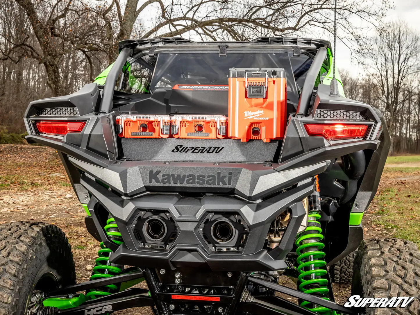 Kawasaki SuperATV vehicle with green suspension in a natural setting