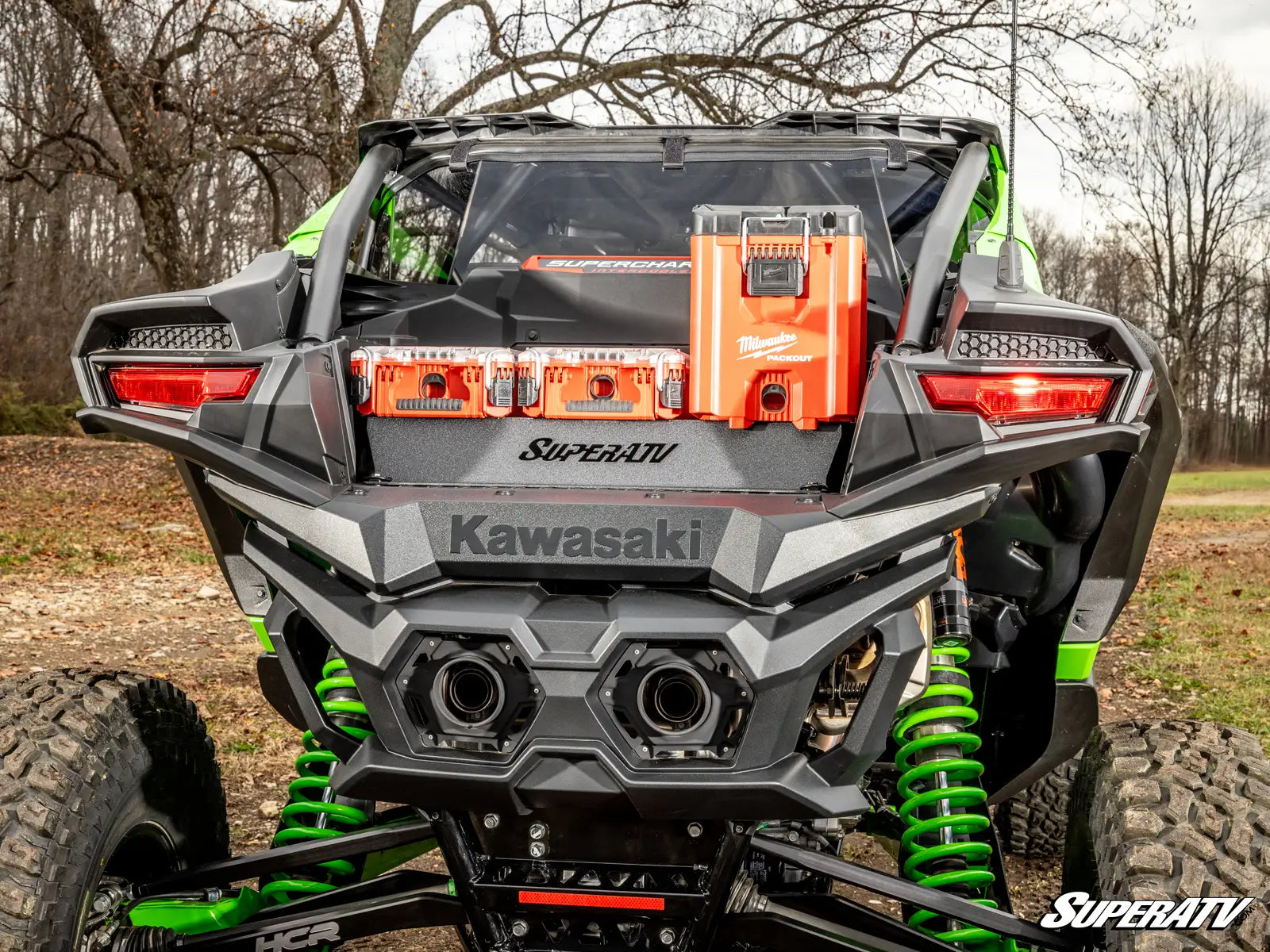 Kawasaki SuperATV vehicle with green suspension in a natural setting