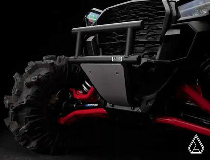 Close-up of a rugged off-road vehicle with a black and red design on a dark background.