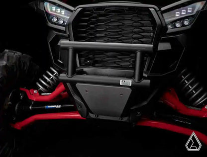 Close-up of a vehicle grille with red accents and a black bumper.