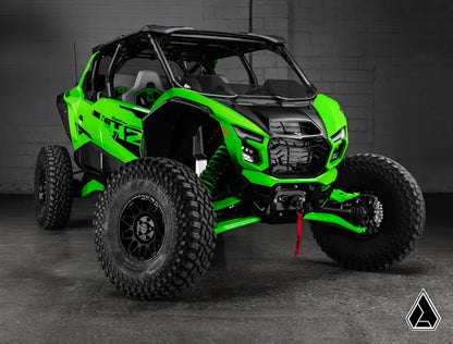 Green off-road vehicle with black accents on a dark background