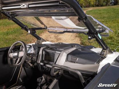 Close-up of a SuperATV vehicle interior with dashboard and steering wheel.