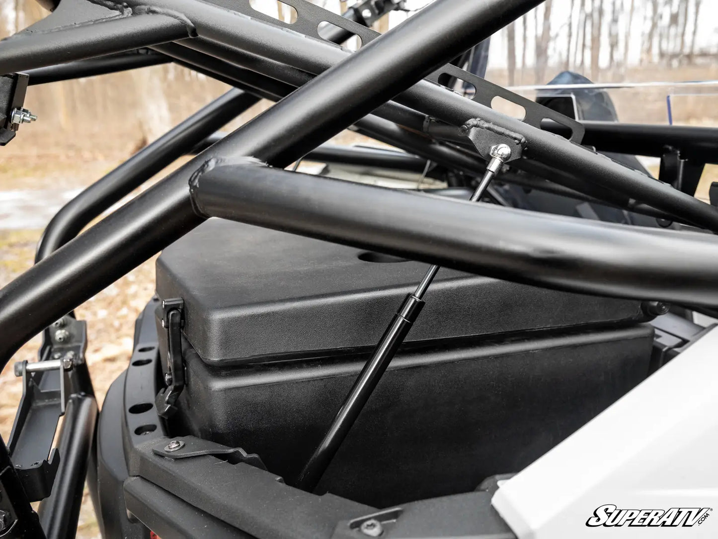 Close-up of a black metal frame structure with 'SuperATV' branding.