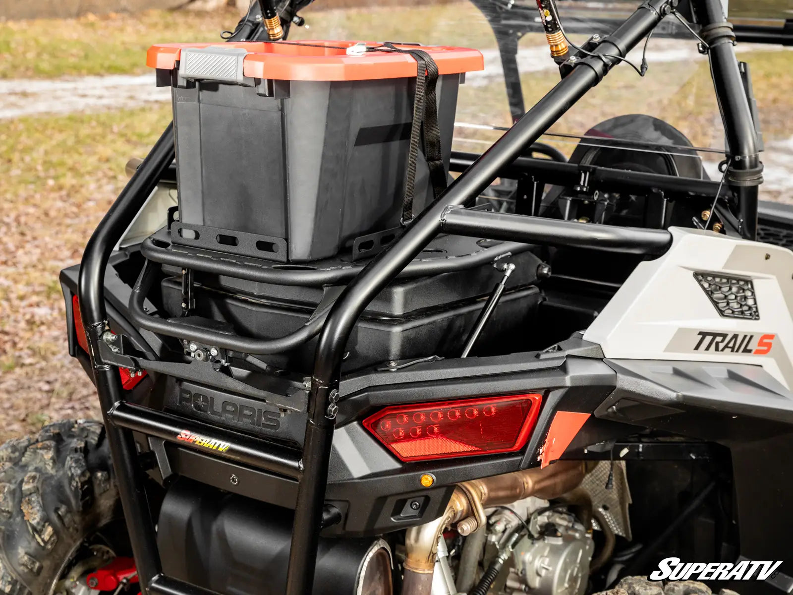 Back view of a Polaris ATV with storage box and visible branding.