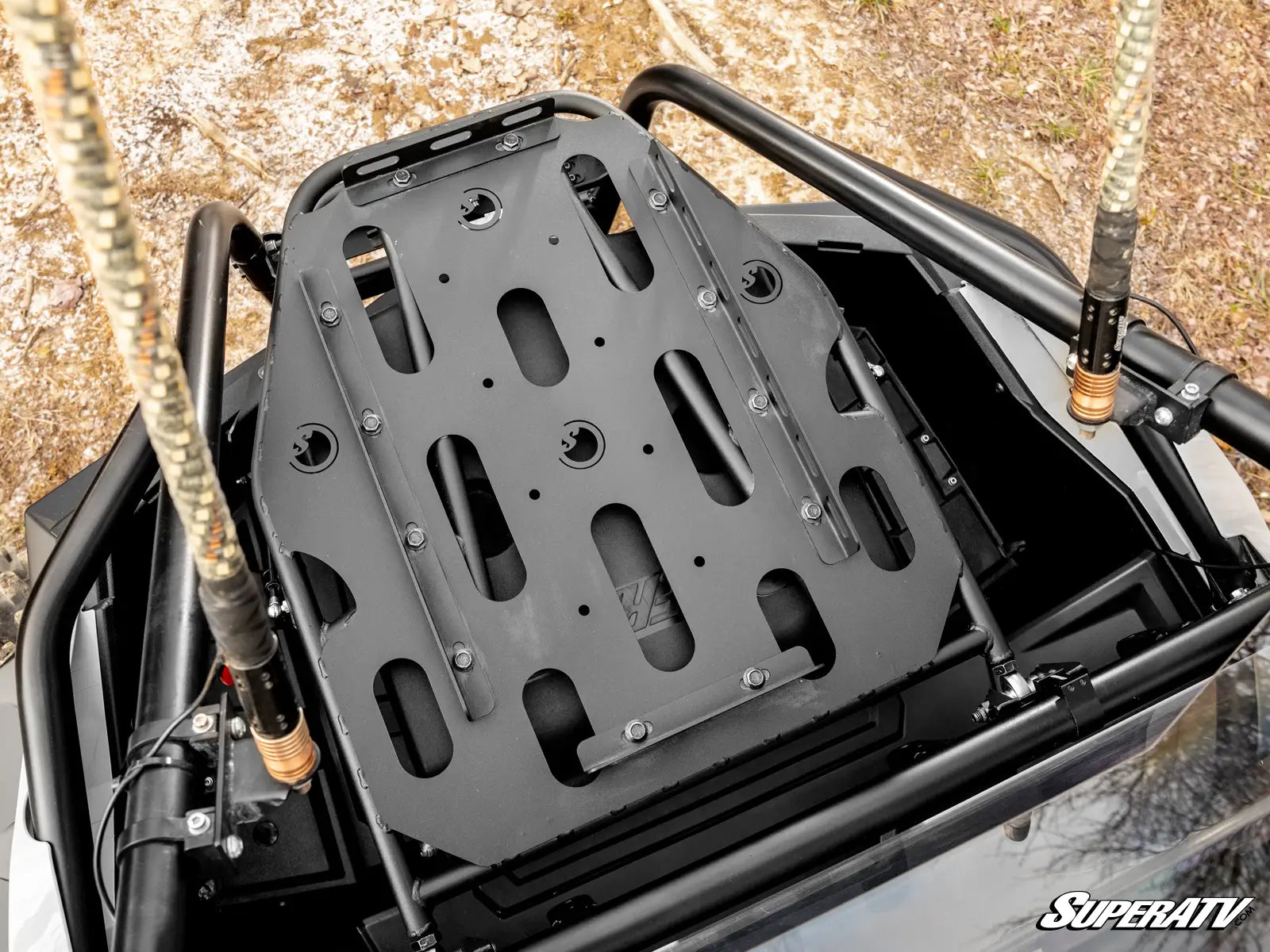 Black metal luggage rack on a vehicle with 'SuperATV' branding.