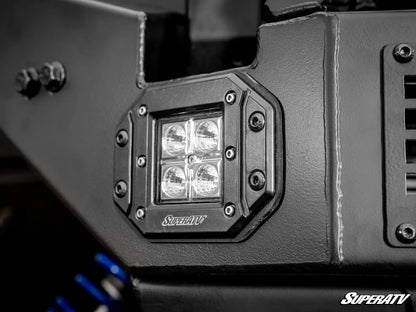 Close-up of a SuperATV light mount on a vehicle, with four LED lights.