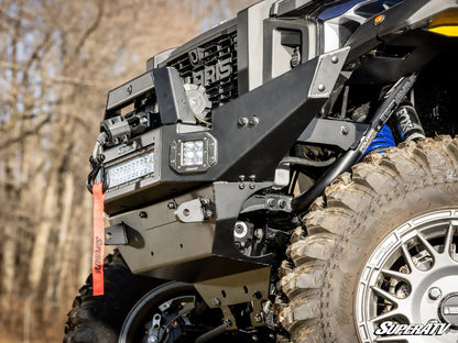 Close-up of a rugged off-road vehicle with visible branding in a natural setting.