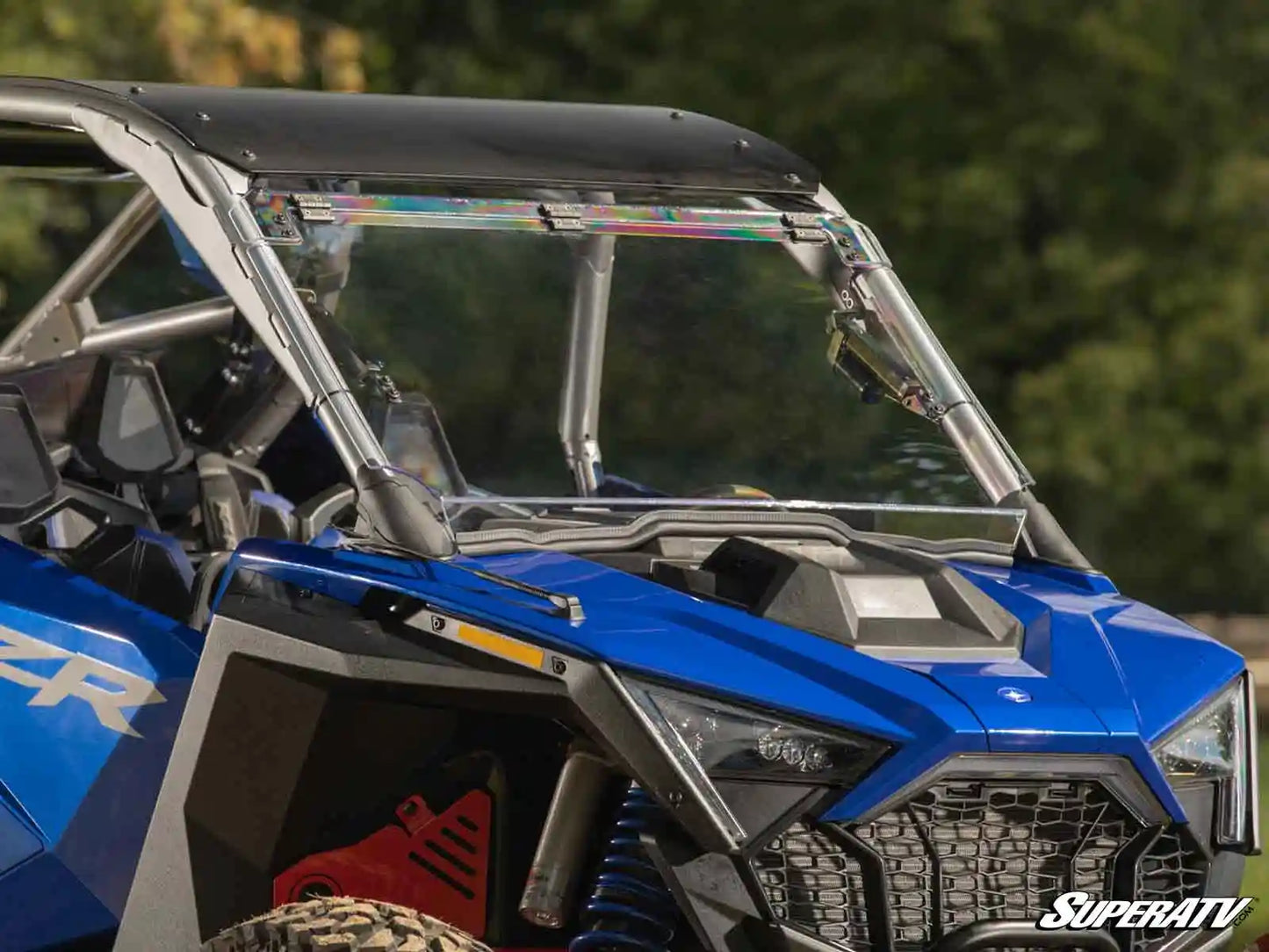 Blue off-road vehicle with a clear windshield and SuperATV branding.