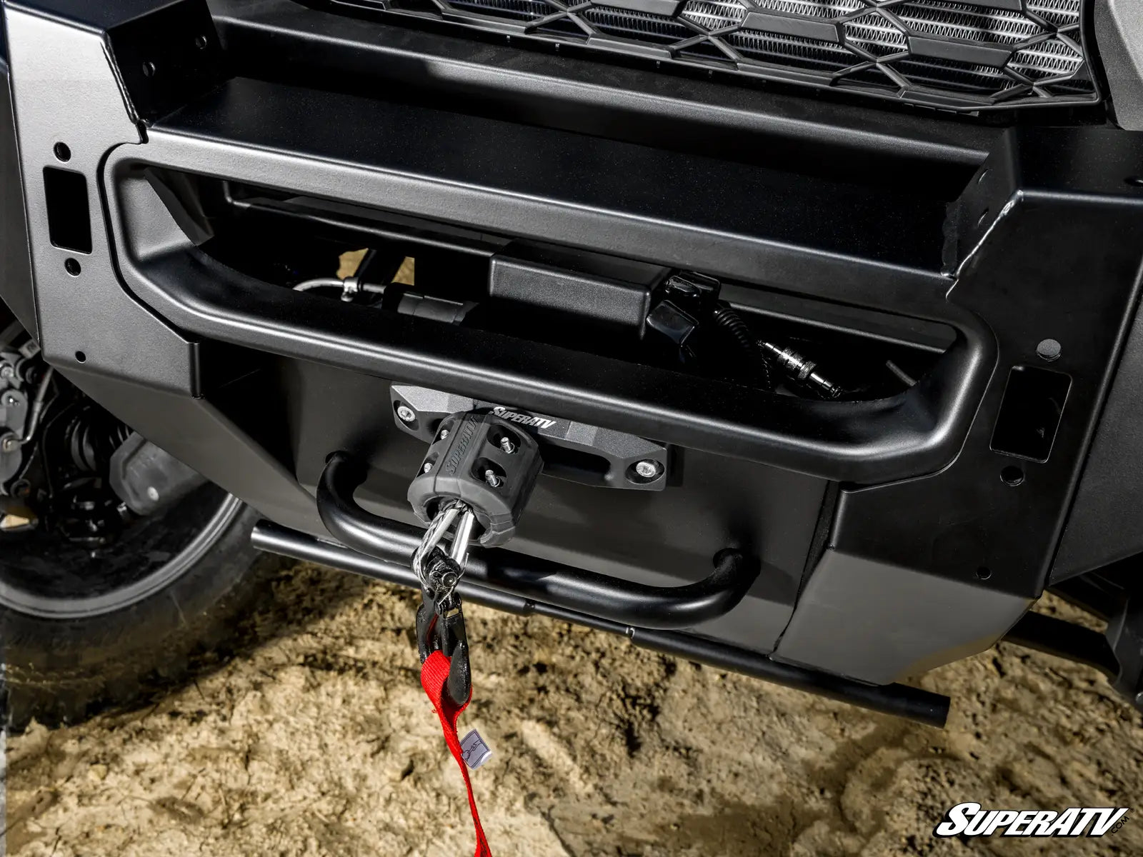 Close-up of a vehicle's bumper with a chain and SuperATV logo.