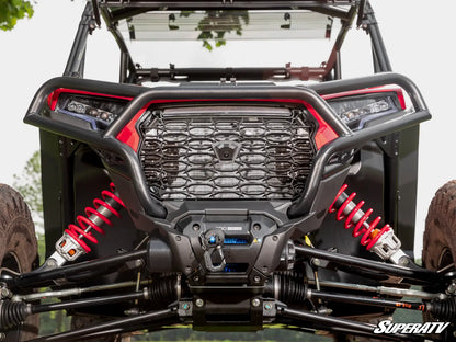 Close-up of a Polaris RZR with a SuperATV bumper and suspension system.