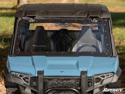 Front view of a Polaris SuperATV vehicle with a blue hood and black roof.