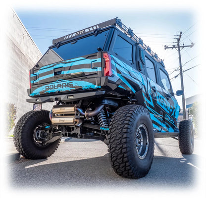 Blue off-road vehicle with 'Polaris' branding on a street.