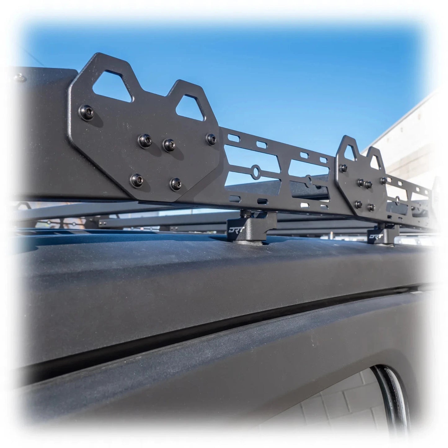 Roof rack system on a vehicle with a clear blue sky background