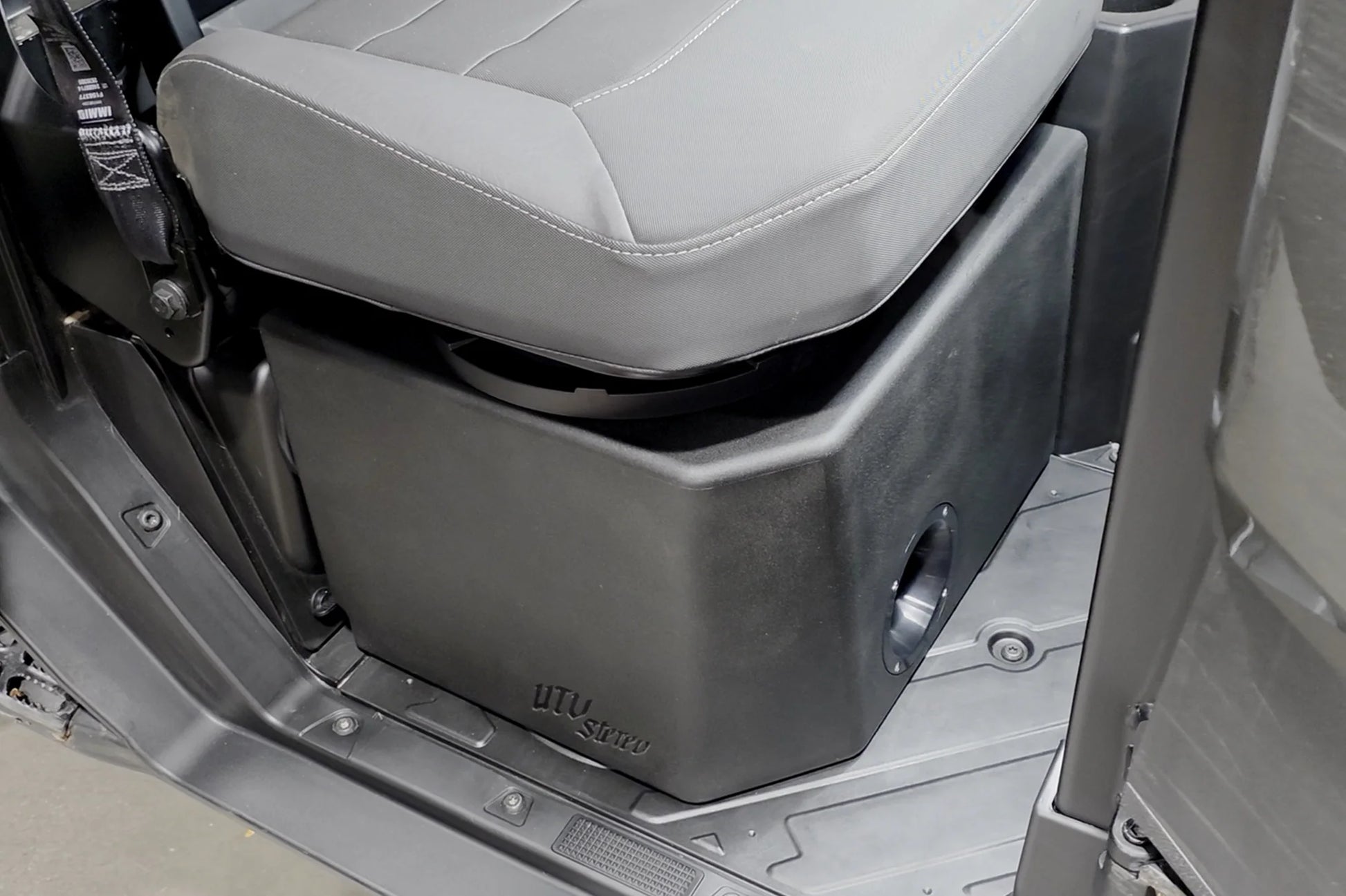 Gray car seat folded down inside a vehicle