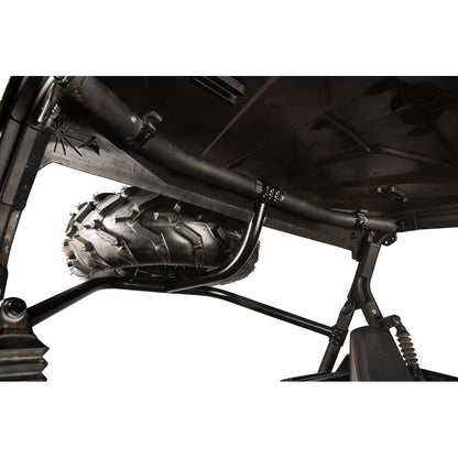 Black metal undercarriage crossmember and roll bar assembly mounted over an all-terrain vehicle tire, shown against a white background.