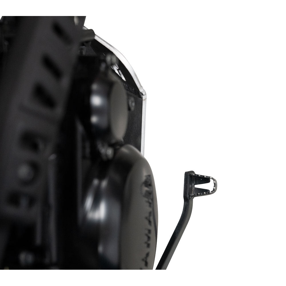 Close-up of a black motorcycle or scooter engine component with a small black metal mounting bracket attached on the right side, photographed against a plain white background.
