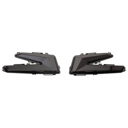 Two black car taillights on a white background