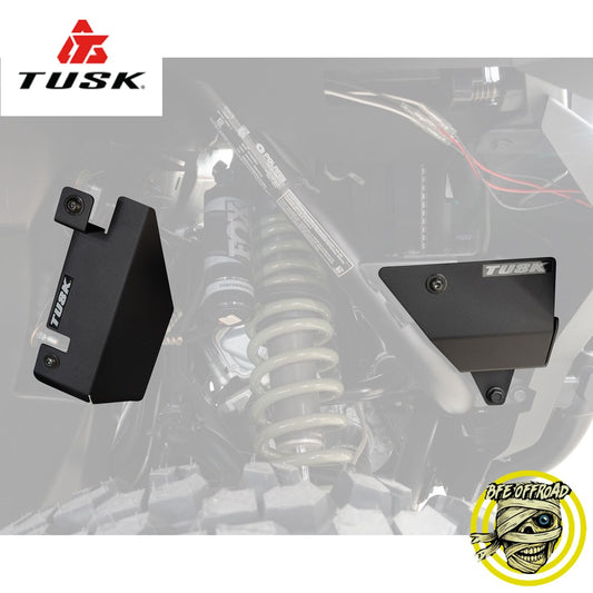 Tusk suspension components on a blurred off-road vehicle background with Tusk logo.